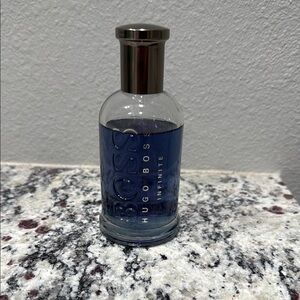 Hugo Boss Infinite Fragrance with Silver Cap and Blue Hue